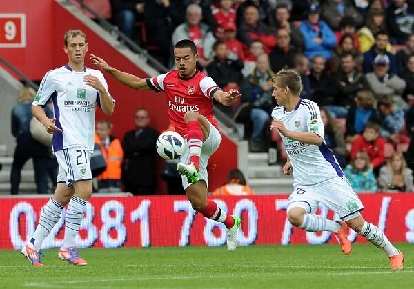 Arsenal's Nico Yennaris Faces Off Against Dennis Praet and Tom De Sutter of Anderlecht in Pre-Season Clash