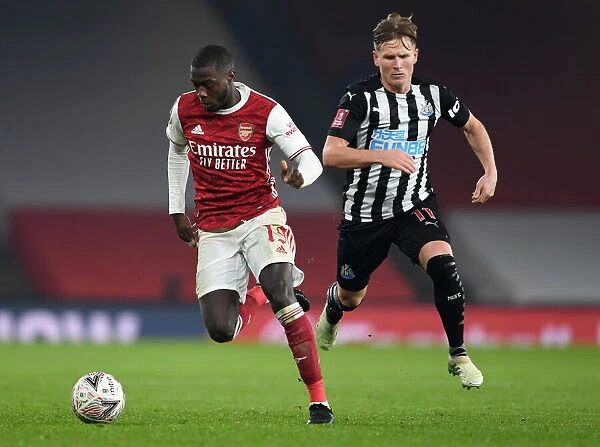 Arsenal's Nicolas Pepe Clashes with Newcastle's Matt Ritchie in FA Cup Third Round
