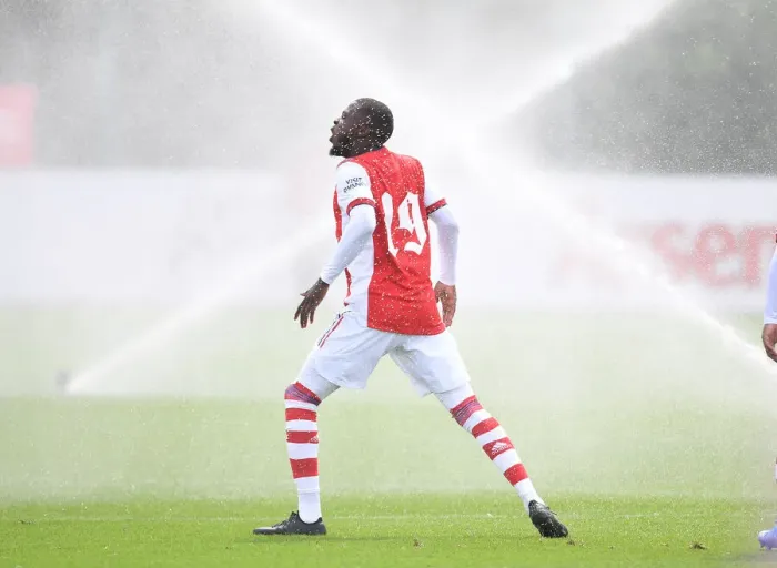 Framed Print : Arsenal's Nicolas Pepe Dodges Pitch Sprinklers Before Arsenal v Watford Pre-Season Friendly Framed Print : Arsenal's Nicolas Pepe Dodges Pitch Sprinklers Before Arsenal v Watford Pre-Season Friendly