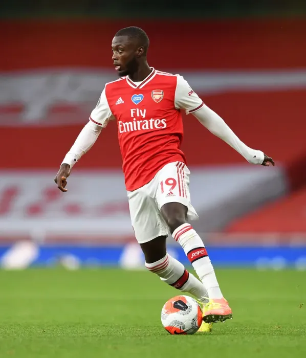 Framed Print : Arsenal's Nicolas Pepe Faces Empty Emirates Stadium in Arsenal vs. Liverpool (2019-20)