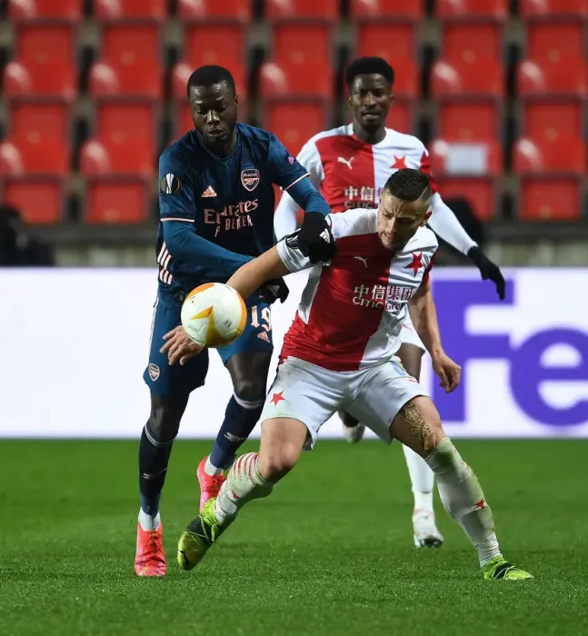Framed Print : Arsenal's Nicolas Pepe Faces Off Against Slavia Praha's Tomas Holes in Europa League Quarterfinal: Prague Showdown Framed Print : Arsenal's Nicolas Pepe Faces Off Against Slavia Praha's Tomas Holes in Europa League Quarterfinal: Prague Showdown