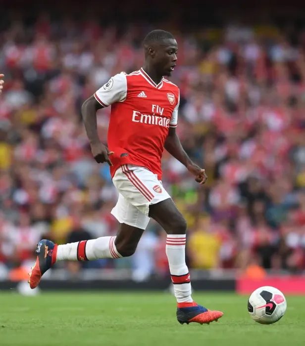Framed Print : Arsenal's Nicolas Pepe Faces Off Against Tottenham in Premier League Showdown