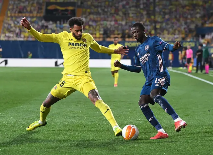 Framed Print : Arsenal's Nicolas Pepe Faces Off Against Villarreal's Etienne Capoue in Europa League Semi-Final