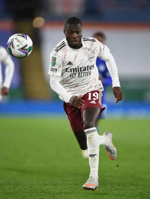 Framed Print : Arsenal's Nicolas Pepe Goes Head-to-Head with Leicester City in Carabao Cup Clash