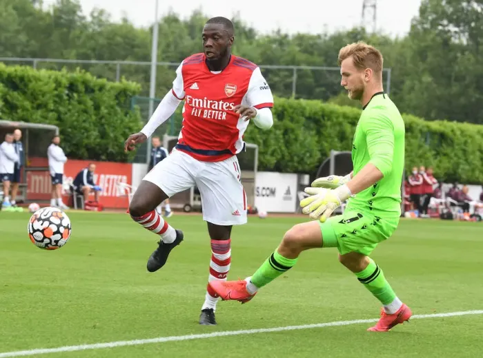 Framed Print : Arsenal's Nicolas Pepe Goes Head-to-Head with Millwall's George Long in Pre-Season Clash Framed Print : Arsenal's Nicolas Pepe Goes Head-to-Head with Millwall's George Long in Pre-Season Clash