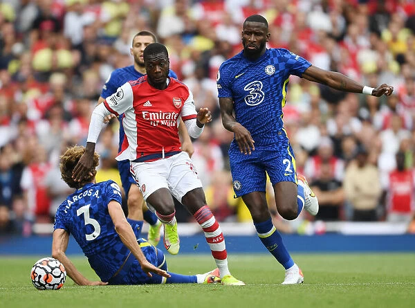 Arsenal's Nicolas Pepe Outmaneuvers Chelsea's Alonso and Rudiger in the 2021-22 Premier League Clash