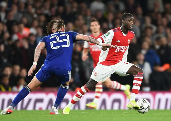 Arsenal's Nicolas Pepe Outmaneuvers Leeds Kalvin Phillips in Carabao Cup Clash