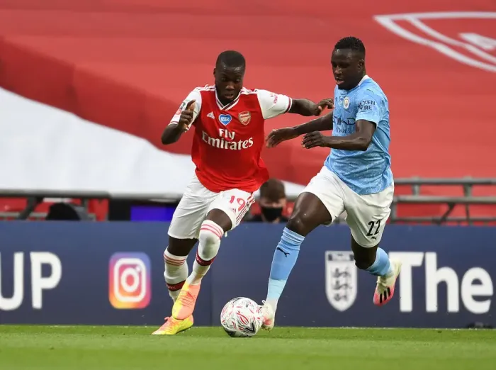 Framed Print : Arsenal's Nicolas Pepe Outmaneuvers Manchester City's Benjamin Mendy in FA Cup Semi-Final Showdown Framed Print : Arsenal's Nicolas Pepe Outmaneuvers Manchester City's Benjamin Mendy in FA Cup Semi-Final Showdown