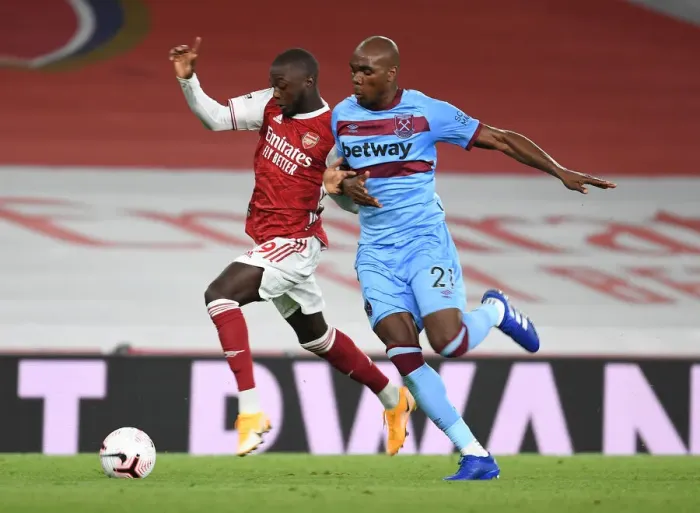 Framed Print : Arsenal's Nicolas Pepe Outmaneuvers West Ham's Angelo Ogbonna in Premier League Clash Framed Print : Arsenal's Nicolas Pepe Outmaneuvers West Ham's Angelo Ogbonna in Premier League Clash