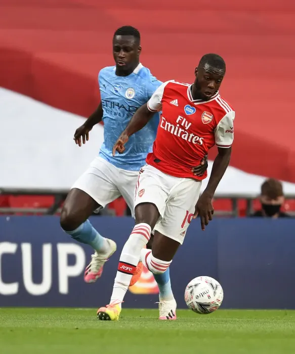 Framed Print : Arsenal's Nicolas Pepe Outsmarts Manchester City's Mendy in FA Cup Semi-Final Thriller Framed Print : Arsenal's Nicolas Pepe Outsmarts Manchester City's Mendy in FA Cup Semi-Final Thriller
