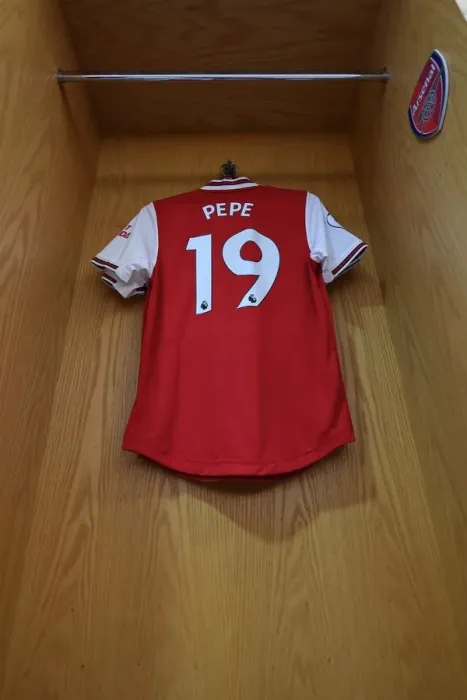 Framed Print : Arsenal's Nicolas Pepe Prepares for Aston Villa Clash in Emirates Stadium Changing Room Framed Print : Arsenal's Nicolas Pepe Prepares for Aston Villa Clash in Emirates Stadium Changing Room