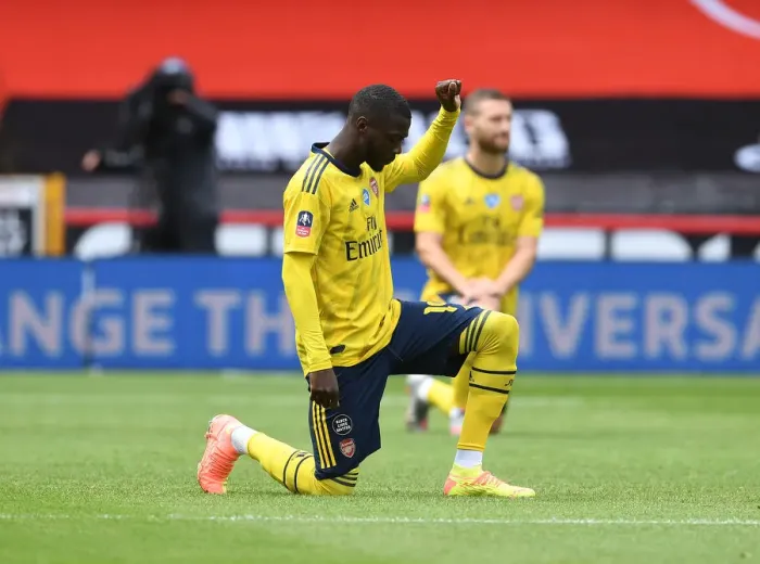 Framed Print : Arsenal's Nicolas Pepe Takes a Knee before Sheffield United FA Cup Quarterfinal