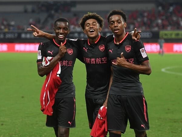 Arsenal's Nketiah, Nelson, and Willock: Post-Match Huddle in Shanghai (Bayern Munich vs Arsenal, 2017-18)