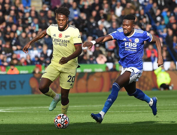 Arsenal's Nuno Tavares Clashes with Leicester's Daniel Amartey in Premier League Showdown