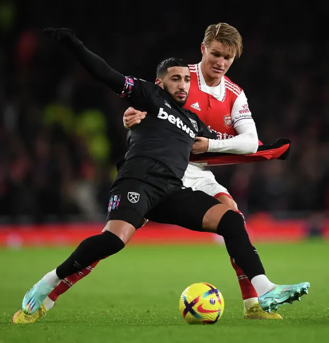 Framed Print : Arsenal's Odegaard Chases Down Benrahma: A Battle of Determination in Arsenal vs. West Ham Match Framed Print : Arsenal's Odegaard Chases Down Benrahma: A Battle of Determination in Arsenal vs. West Ham Match
