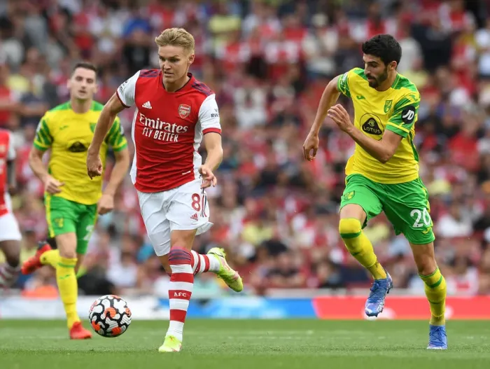 Framed Print : Arsenal's Odegaard Clashes with Norwich's Lees-Melou: A Premier League Showdown at Emirates Stadium Framed Print : Arsenal's Odegaard Clashes with Norwich's Lees-Melou: A Premier League Showdown at Emirates Stadium
