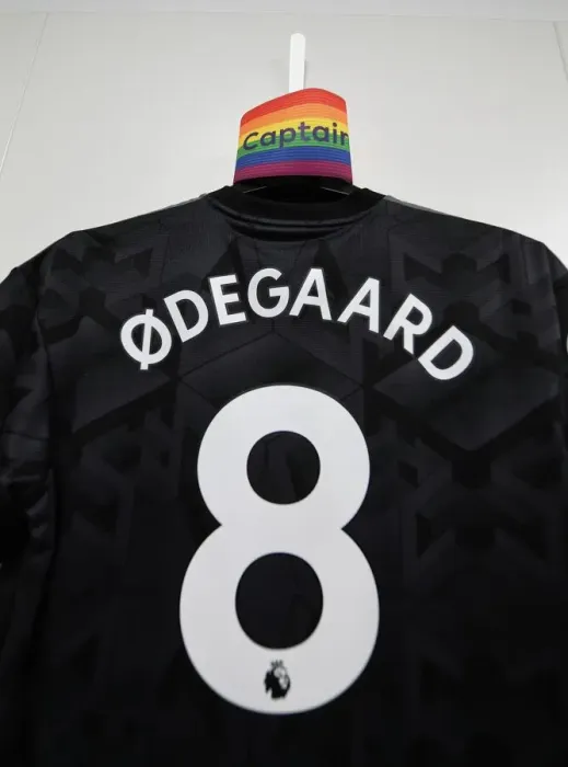 Framed Print : Arsenal's Odegaard Prepares for Southampton Clash: Captain's Armband and Shirt in Changing Room