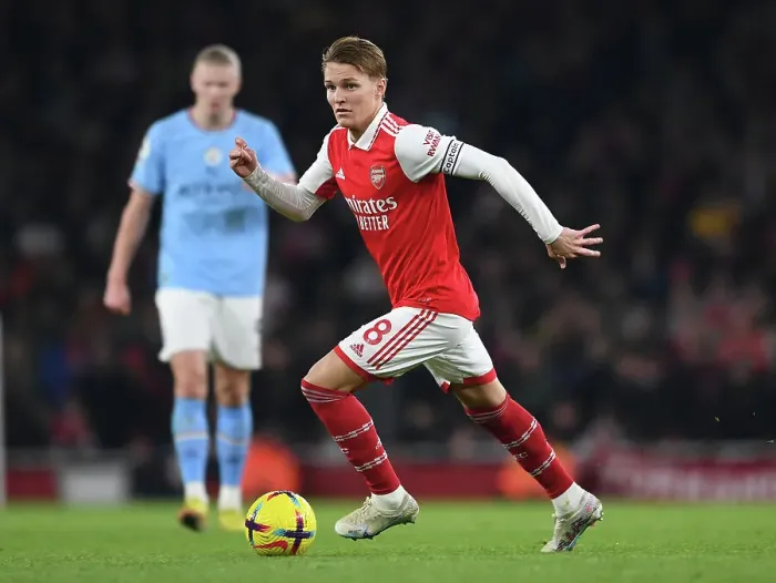 Framed Print : Arsenal's Odegaard Takes on Manchester City: A Midfield Battle Framed Print : Arsenal's Odegaard Takes on Manchester City: A Midfield Battle