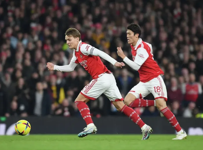 Framed Print : Arsenal's Odegaard and Tomiyasu in Action against Manchester City, Premier League 2022-23