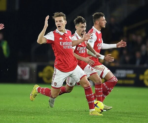 Arsenal's Odegaard, Vieira, and White in Action: Premier League 2022-23 - Wolverhampton Wanderers vs. Arsenal