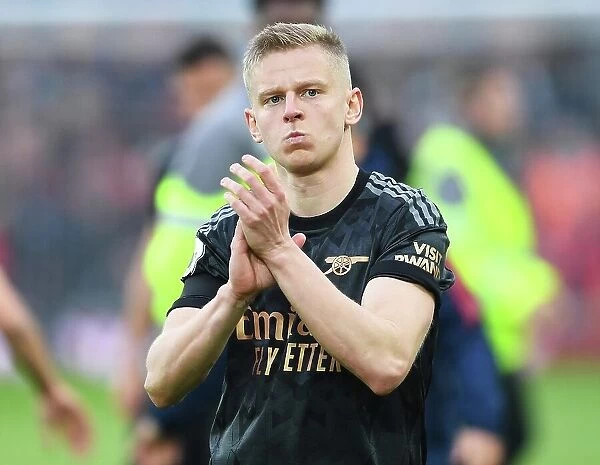 Arsenal's Oleksandr Zinchenko Celebrates with Fans after Intense Liverpool Victory (2022-23)