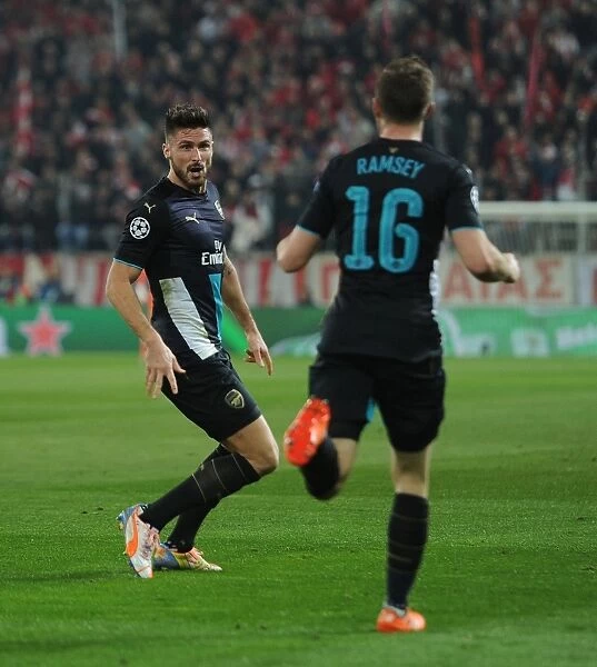 Arsenal's Olivier Giroud and Aaron Ramsey Celebrate Goal in UEFA Champions League Match Against Olympiacos, 2015-16