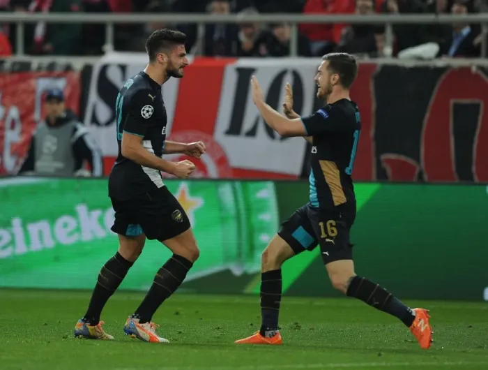 Framed Print : Arsenal's Olivier Giroud and Aaron Ramsey Celebrate First Goal in UEFA Champions League Match Against Olympiacos Framed Print : Arsenal's Olivier Giroud and Aaron Ramsey Celebrate First Goal in UEFA Champions League Match Against Olympiacos