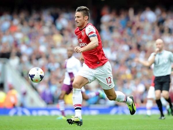 Arsenal's Olivier Giroud in Action against Aston Villa in the 2013-14 Premier League