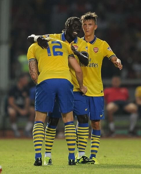 Arsenal's Olivier Giroud, Bacary Sagna, and Kris Olsson Celebrate Goal Against Indonesia All-Stars