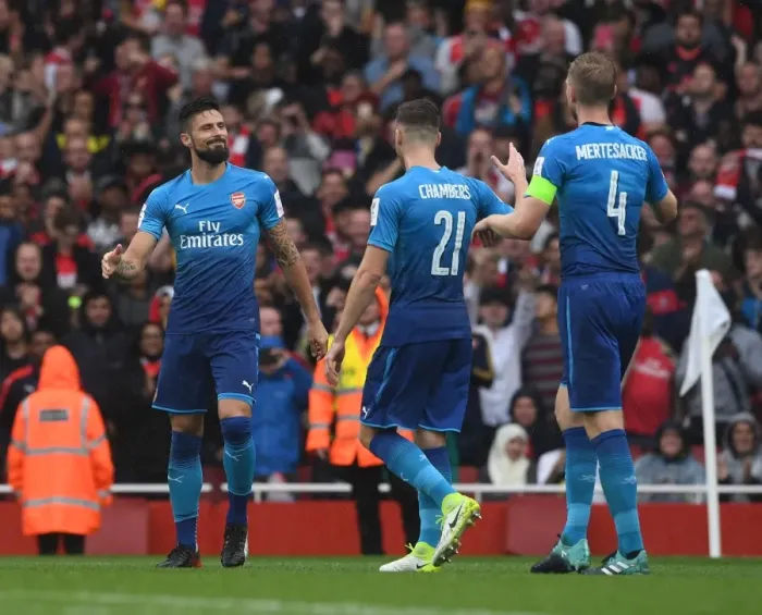 Framed Print : Arsenal's Olivier Giroud, Calum Chambers, and Per Mertesacker Celebrate Goal vs SL Benfica (Emirages Cup 2017-18) Framed Print : Arsenal's Olivier Giroud, Calum Chambers, and Per Mertesacker Celebrate Goal vs SL Benfica (Emirages Cup 2017-18)