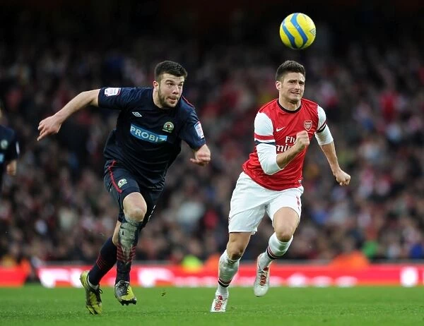 Arsenal's Olivier Giroud Chases Down Blackburn's Grant Hanley in FA Cup Clash