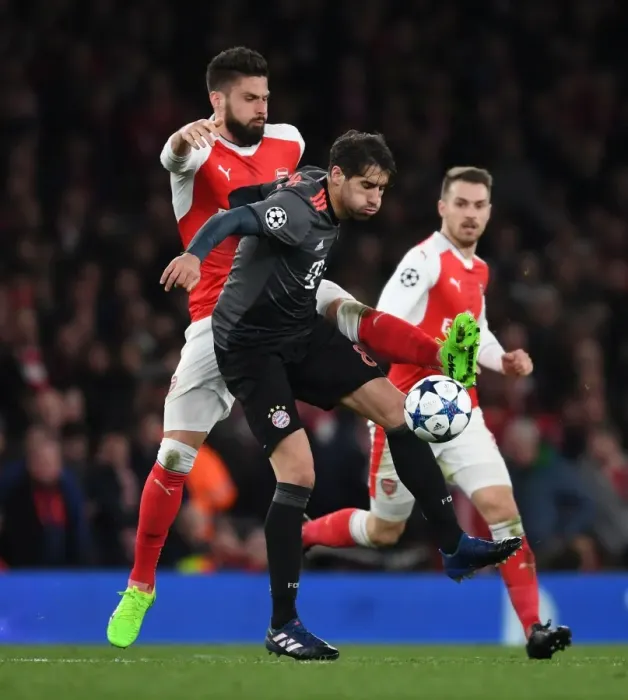Framed Print : Arsenal's Olivier Giroud Clashes with Bayern Munich's Javi Martinez in Champions League Showdown Framed Print : Arsenal's Olivier Giroud Clashes with Bayern Munich's Javi Martinez in Champions League Showdown