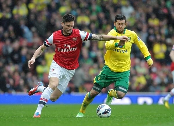 Arsenal's Olivier Giroud Clashes with Norwich's Bradley Johnson in Premier League Showdown