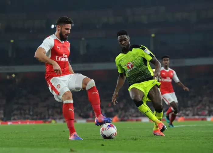 Framed Print : Arsenal's Olivier Giroud Clashes with Reading's Tyler Blackett in EFL Cup Showdown Framed Print : Arsenal's Olivier Giroud Clashes with Reading's Tyler Blackett in EFL Cup Showdown
