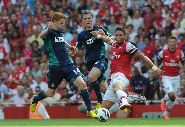 Arsenal's Olivier Giroud Clashes with Sunderland's Jack Colback in 2012-13 Premier League Match