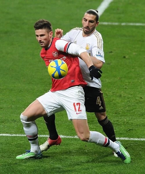 Arsenal's Olivier Giroud Clashes with Swansea's Chico Flores in FA Cup Third Round Replay