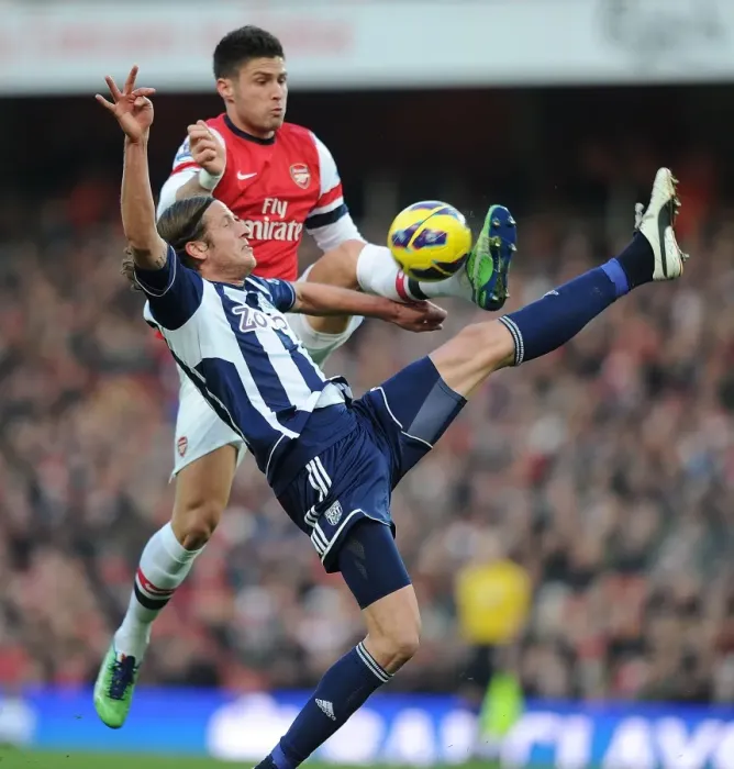 Framed Print : Arsenal's Olivier Giroud Clashes with West Brom's Jonas Olsson in Premier League Showdown Framed Print : Arsenal's Olivier Giroud Clashes with West Brom's Jonas Olsson in Premier League Showdown