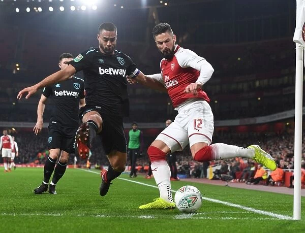 Arsenal's Olivier Giroud Clashes with West Ham's Winston Reid in Carabao Cup Quarterfinal