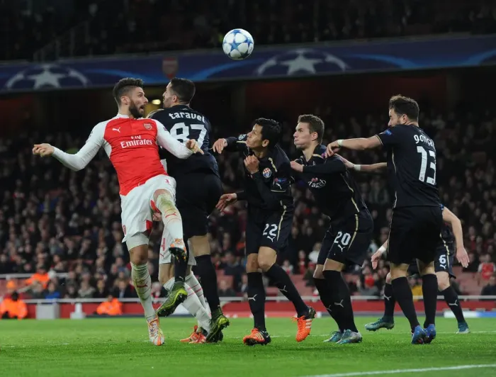 Framed Print : Arsenal's Olivier Giroud Faces Intense Pressure from Dinamo Zagreb Defenders During UEFA Champions League Clash Framed Print : Arsenal's Olivier Giroud Faces Intense Pressure from Dinamo Zagreb Defenders During UEFA Champions League Clash