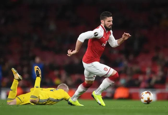 Framed Print : Arsenal's Olivier Giroud Faces Off Against BATE Borisov's Evgeni Berezkin in UEFA Europa League Clash Framed Print : Arsenal's Olivier Giroud Faces Off Against BATE Borisov's Evgeni Berezkin in UEFA Europa League Clash
