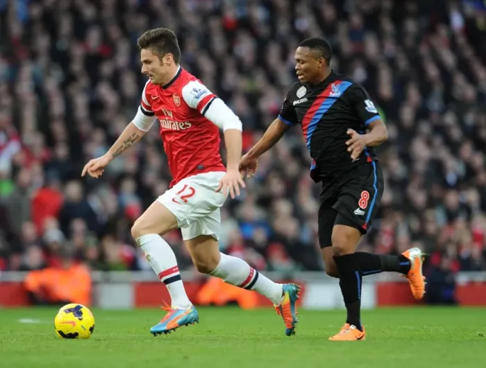 Framed Print : Arsenal's Olivier Giroud Faces Off Against Crystal Palace's Kagisho Dikgacoi in Premier League Clash