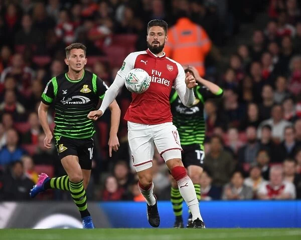 Arsenal's Olivier Giroud Faces Off Against Doncaster's Jordan Houghton in Carabao Cup Clash