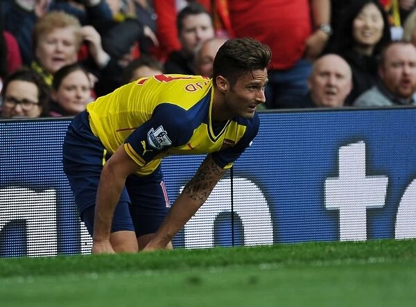 Arsenal's Olivier Giroud Faces Off Against Manchester United in Premier League Clash, 2014-15