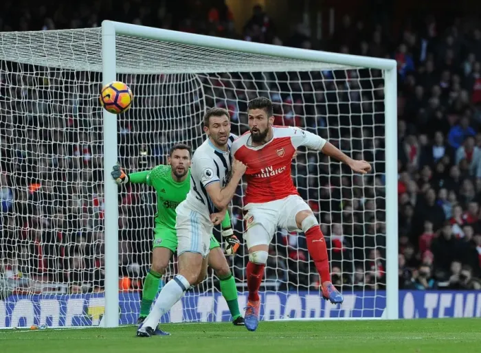 Framed Print : Arsenal's Olivier Giroud Faces Off Against West Brom's Gareth McAuley in Premier League Clash