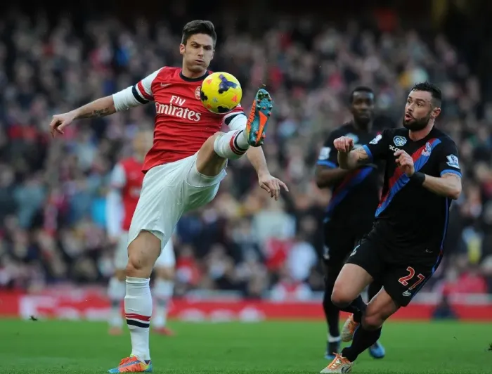 Framed Print : Arsenal's Olivier Giroud Fends Off Crystal Palace's Damien Delaney During Premier League Clash Framed Print : Arsenal's Olivier Giroud Fends Off Crystal Palace's Damien Delaney During Premier League Clash