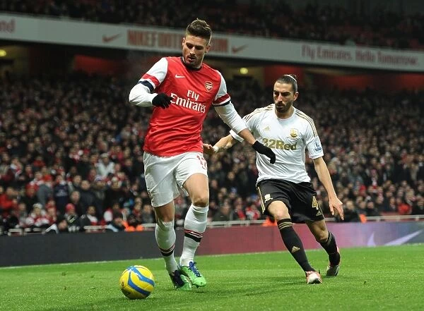 Arsenal's Olivier Giroud Fends Off Swansea's Chico Flores in FA Cup Third Round Replay
