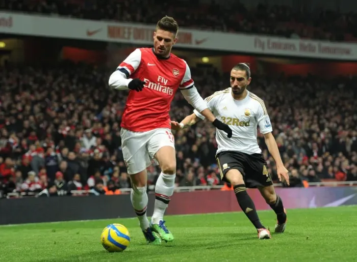 Framed Print : Arsenal's Olivier Giroud Fends Off Swansea's Chico Flores in FA Cup Third Round Replay Framed Print : Arsenal's Olivier Giroud Fends Off Swansea's Chico Flores in FA Cup Third Round Replay