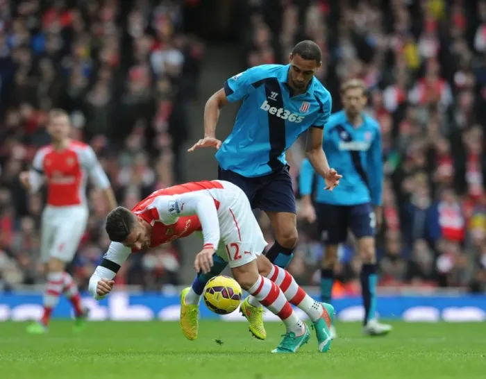 Framed Print : Arsenal's Olivier Giroud Fouled by Stoke's Steven Nzonzi in Premier League Clash Framed Print : Arsenal's Olivier Giroud Fouled by Stoke's Steven Nzonzi in Premier League Clash