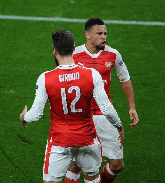 Arsenal's Olivier Giroud and Francis Coquelin Celebrate Goal Against Paris Saint-Germain in 2016-17 Champions League