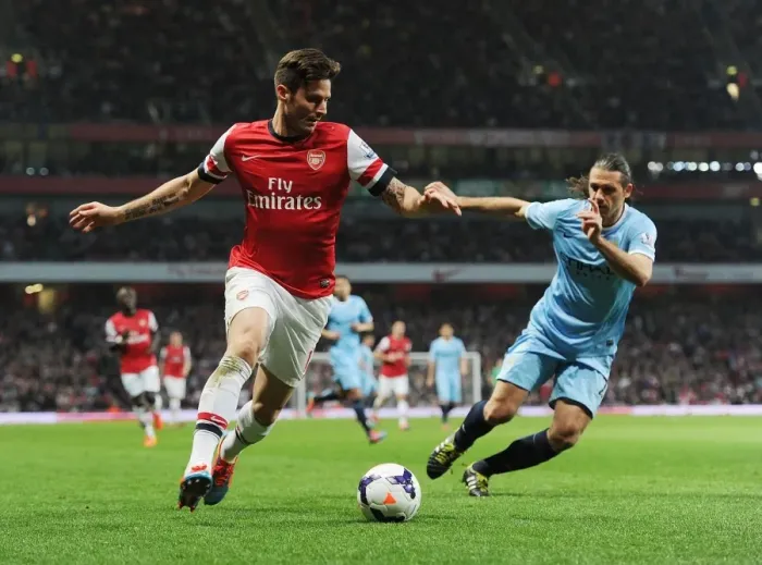 Framed Print : Arsenal's Olivier Giroud Outmaneuvers Manchester City's Martin Demichelis in the 2013 / 14 Premier League Clash